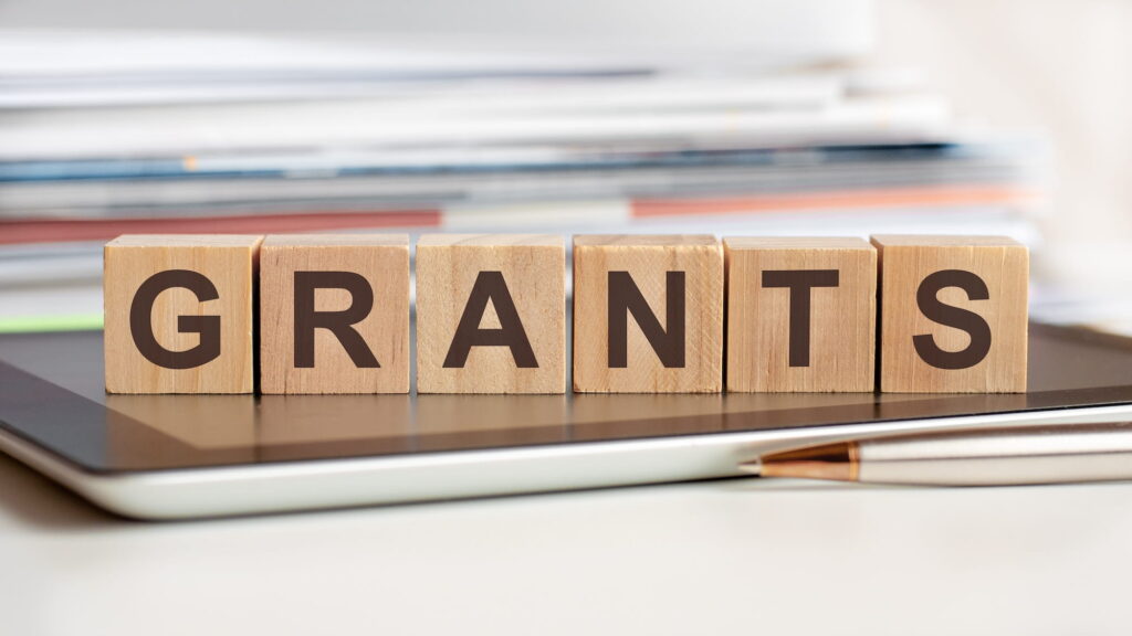Grants written on wooden blocks