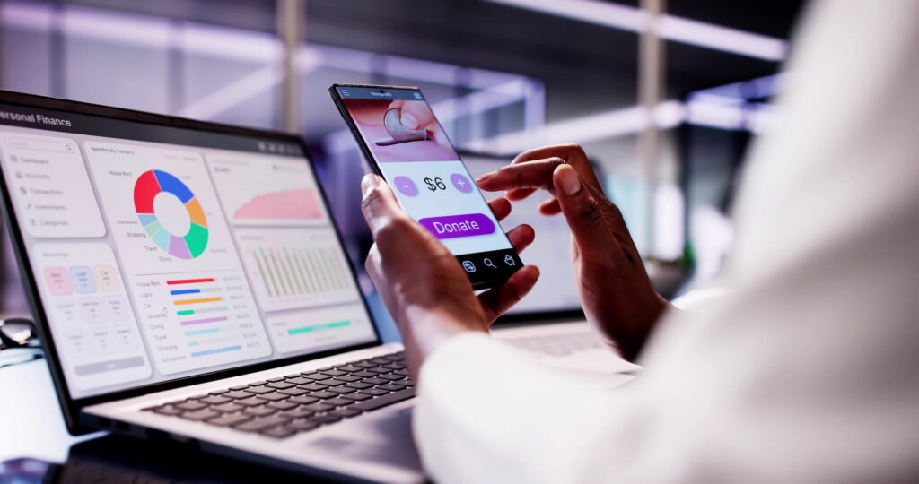 Woman holding phone with donate screen pulled up